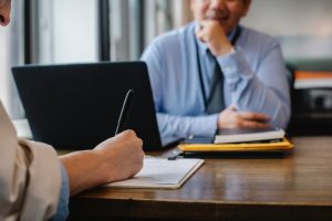 Two people sitting in the office